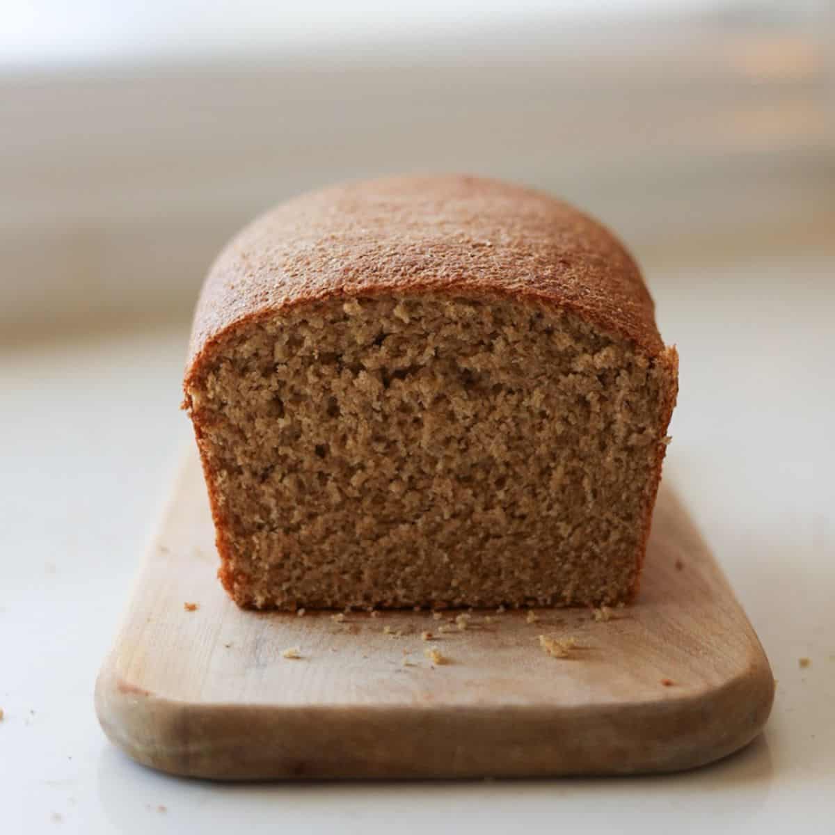 fresh milled sandwich bread sliced on cutting board